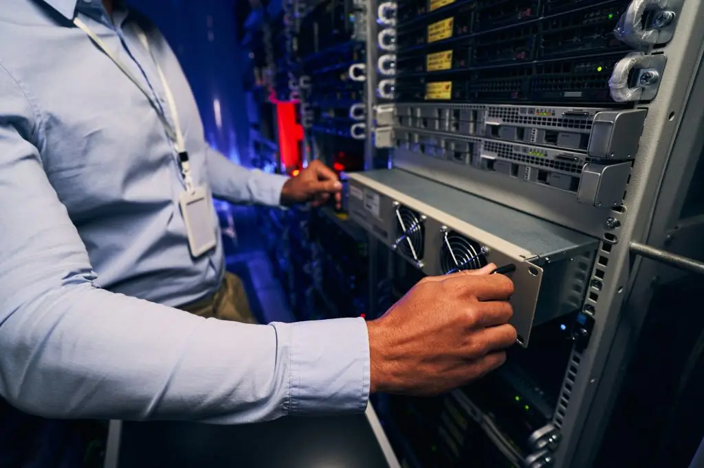 Engineer carrying out data center equipment upgrade